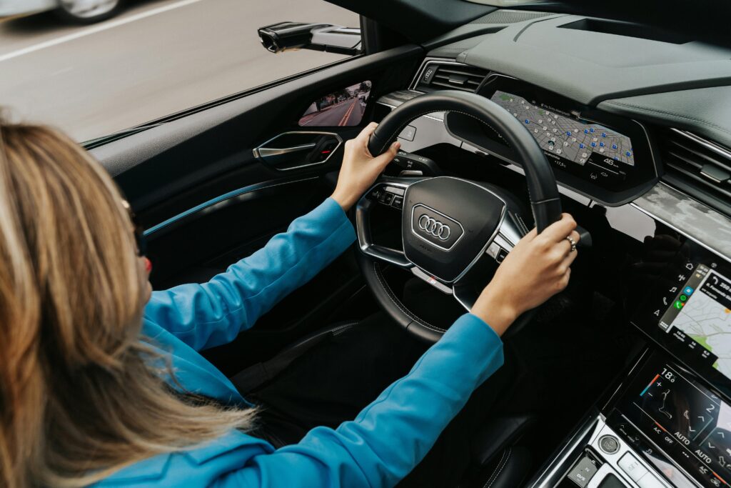 Woman Driving a New Audi Car